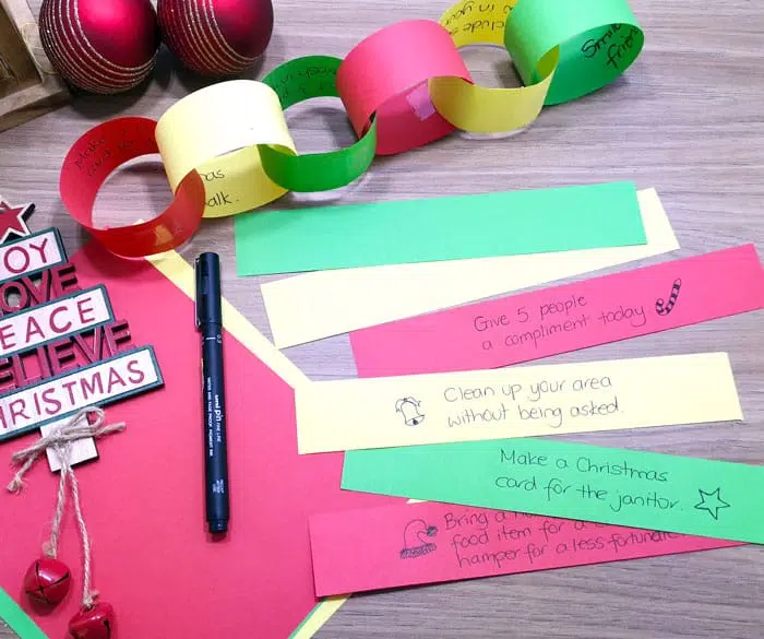 Christmas Kindness Paper Chain With Acts Of Kindness Written On The Inside Of Each Loop.